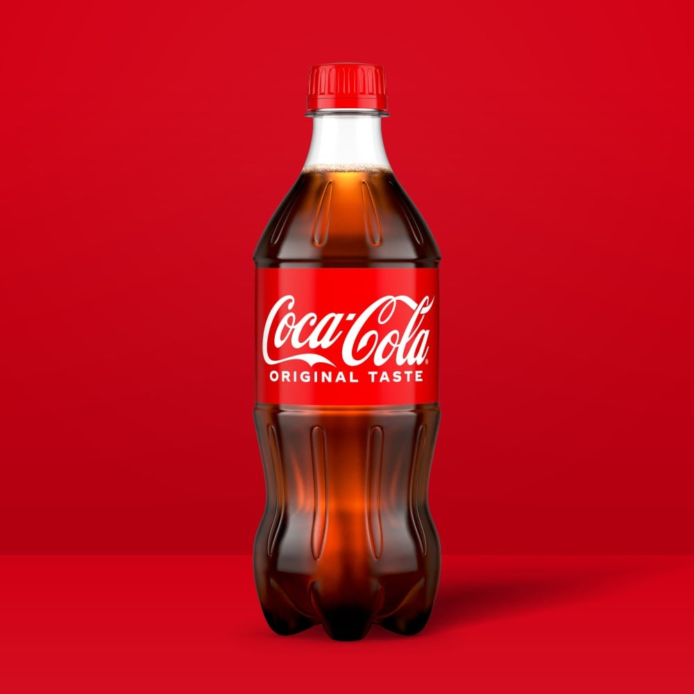 Coca-Cola soda 20 fl oz bottle - bottle on red background